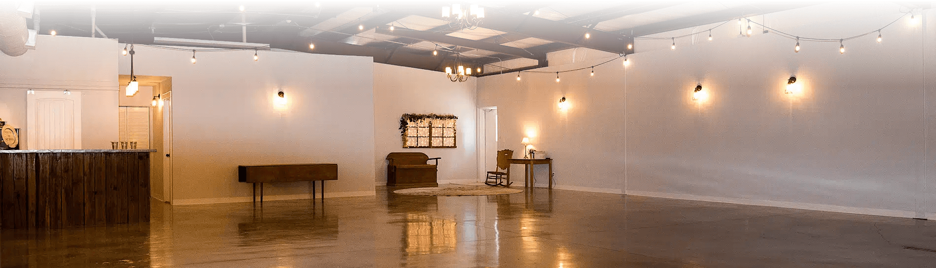 Empty event space with bar and lighting