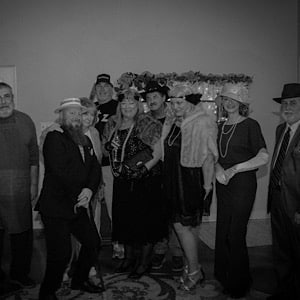 Group of people in character for a 1937 Murder Mystery Dinner.